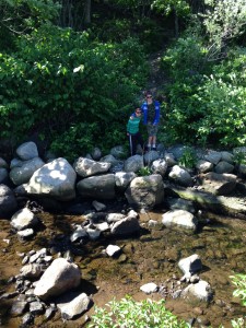 me and ben standing in the woods.