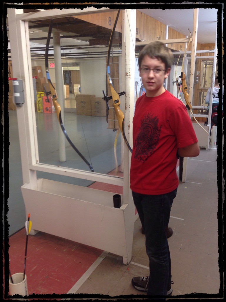 me next to a bow at the archery range.