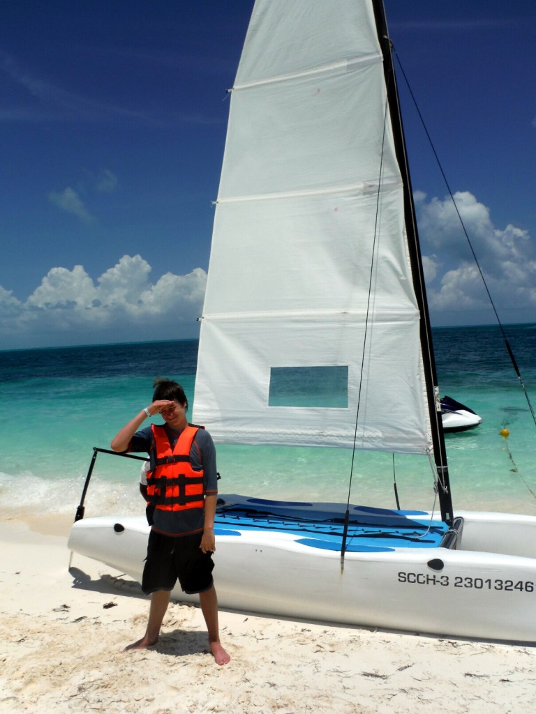 Me standing in front of the sailboat that me and dad sailed on